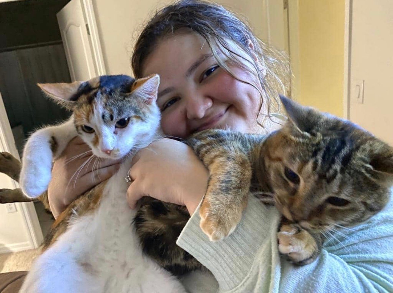 Valerie providing loving in-home care for two cats
